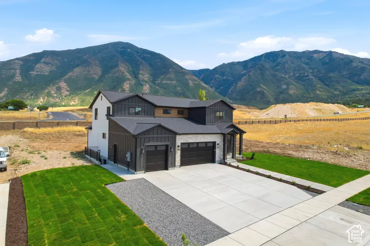 Modern exterior featuring vertical siding and stone accents