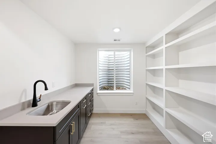 Built-in shelving and cabinetry provide extensive storage