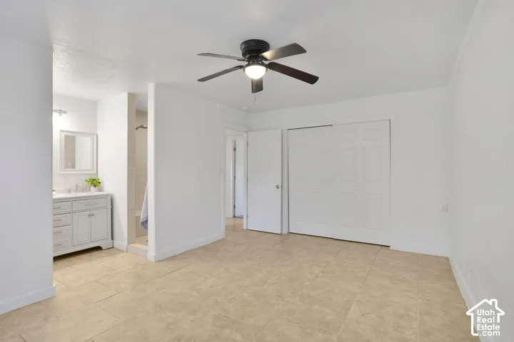 Recessed lighting, tile flooring, built-in vanity with storage, shower stall, and ceiling fan