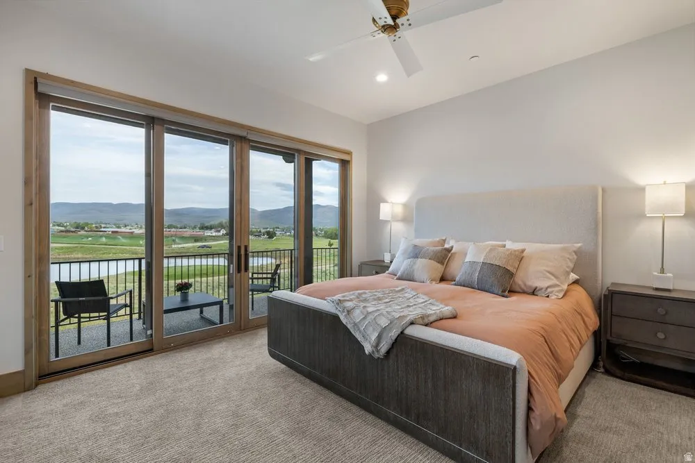 Sliding glass doors opening to a private balcony with metal railing