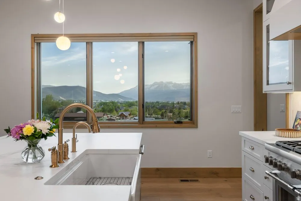 Kitchen island with white countertop and integrated farmhouse sink