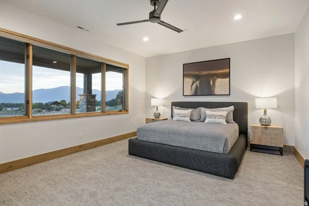 Expansive window wall with natural wood trim and mountain scenery