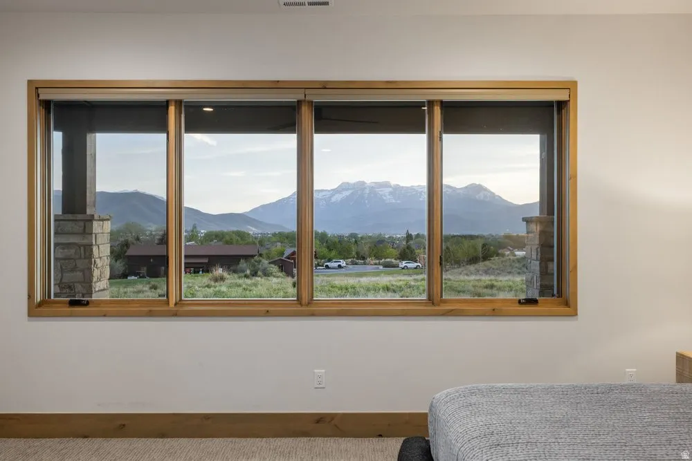 Expansive multi-pane window with natural wood framing