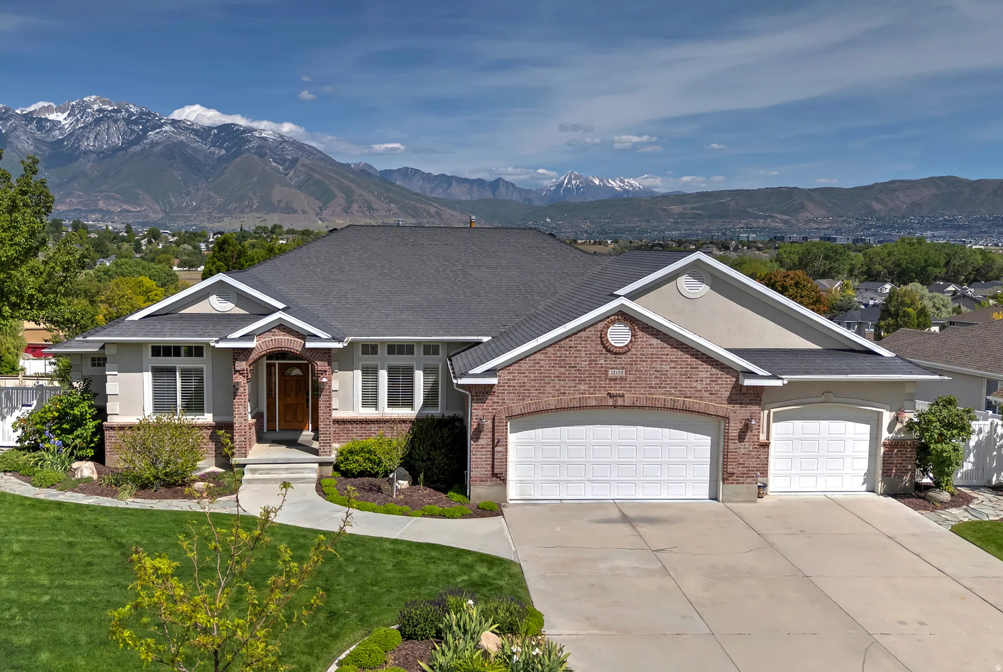 Brick and stucco exterior with an arched entryway