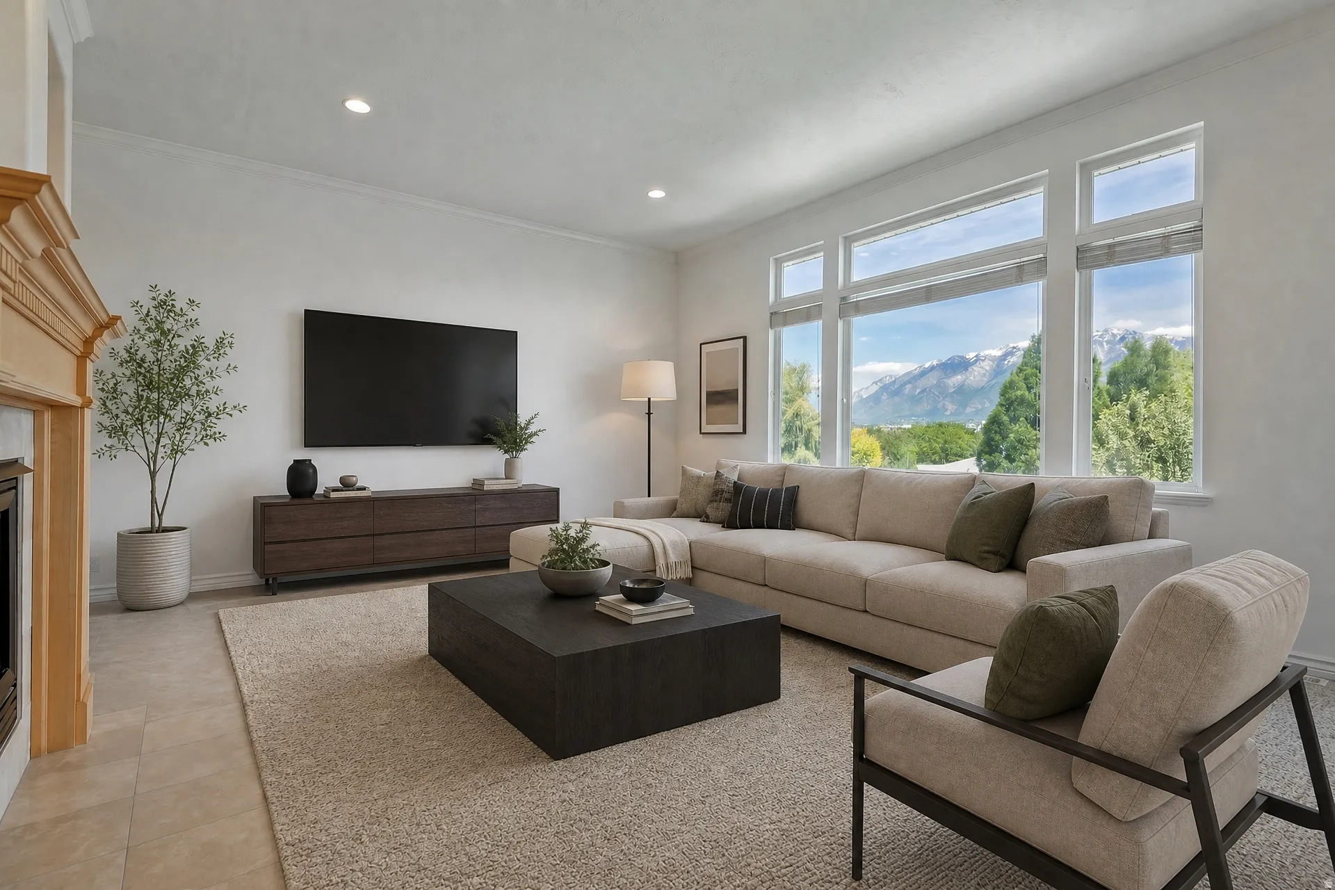 Spacious living area featuring large picture windows, crown molding, recessed lighting, a built-in fireplace with a light wood mantel, and tile flooring