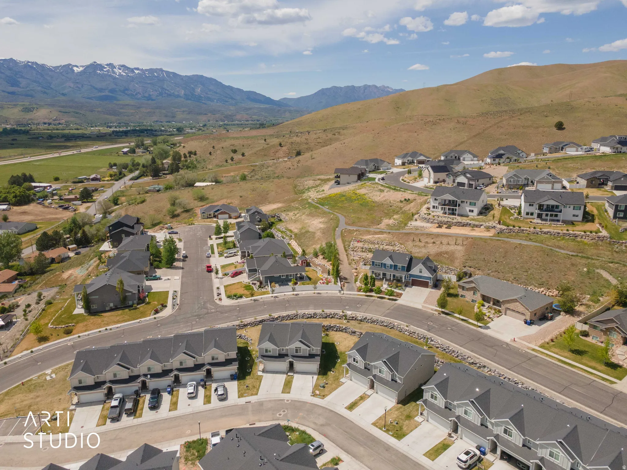 Aerial perspective highlighting a residential development with varied architectural styles