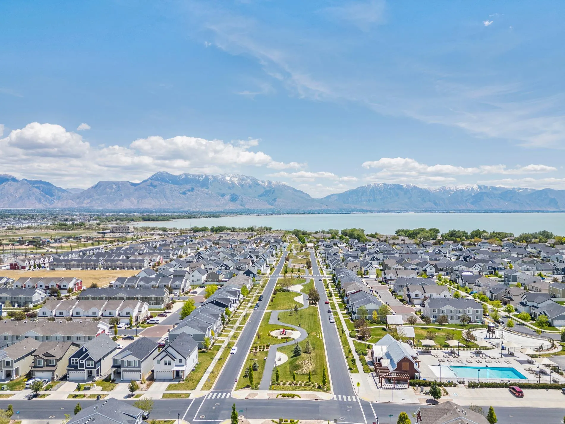 Aerial view showcasing a residential community with a large central green space