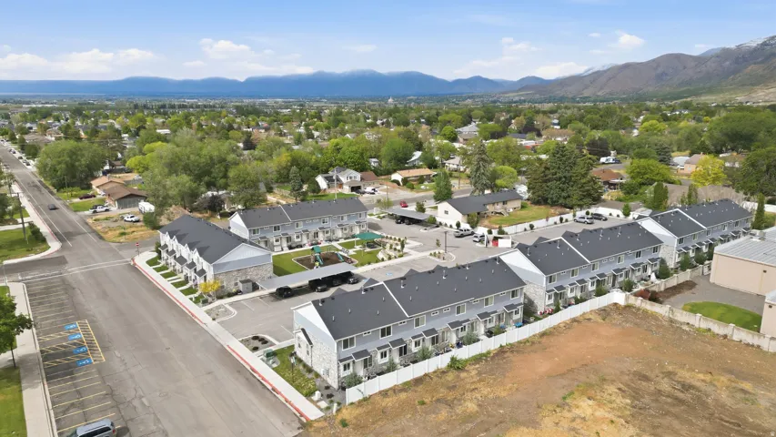 Modern townhome community featuring contemporary gray siding and white stone accents