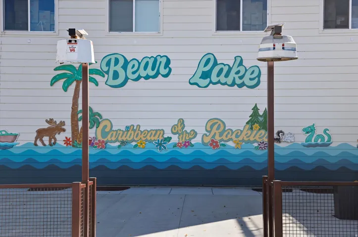 Exterior wall featuring a decorative mural with a lake theme