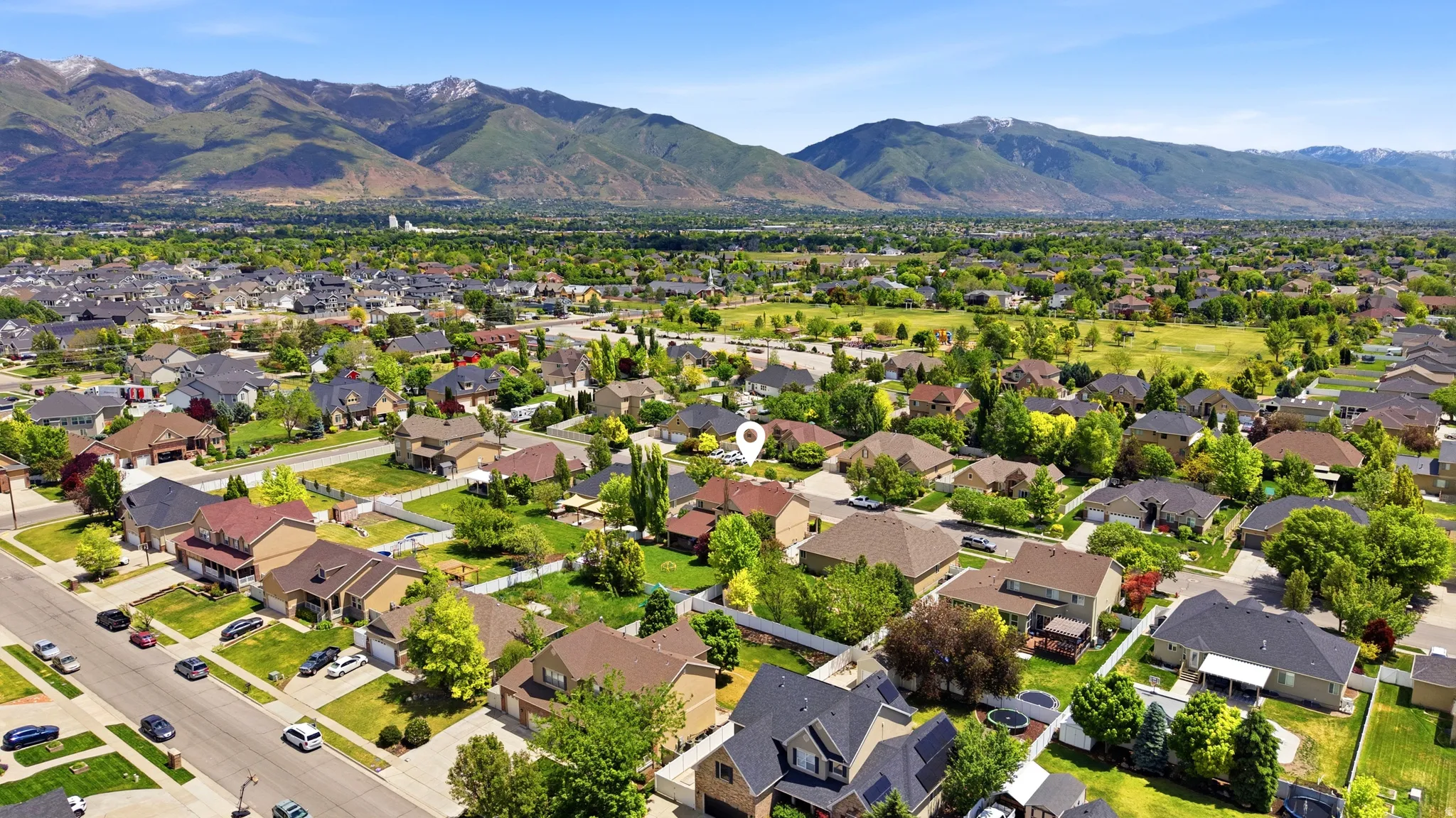 Expansive aerial perspective showcasing a residential neighborhood with diverse home styles