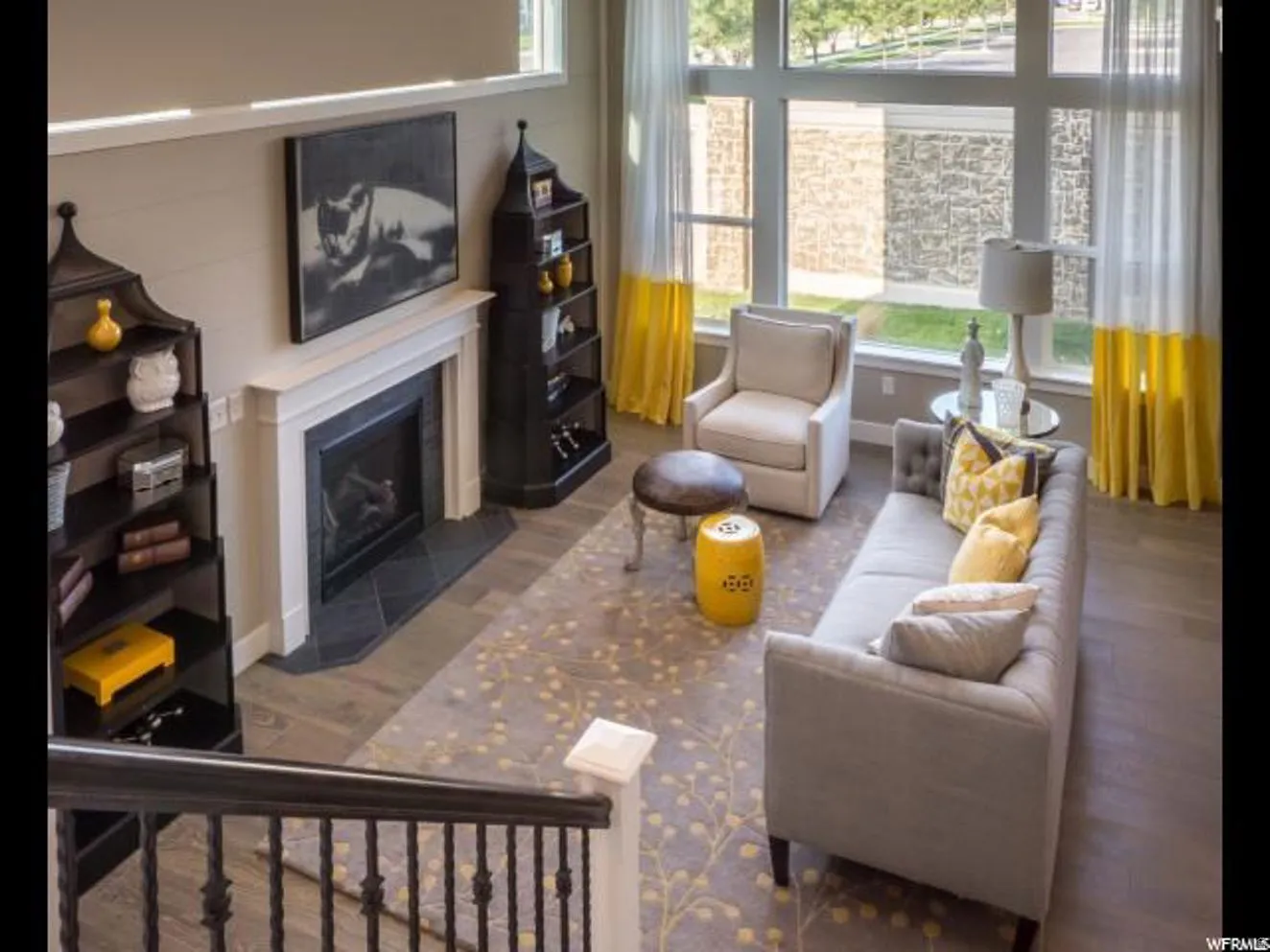 Living area featuring a fireplace with flush hearth and wood finished floors
