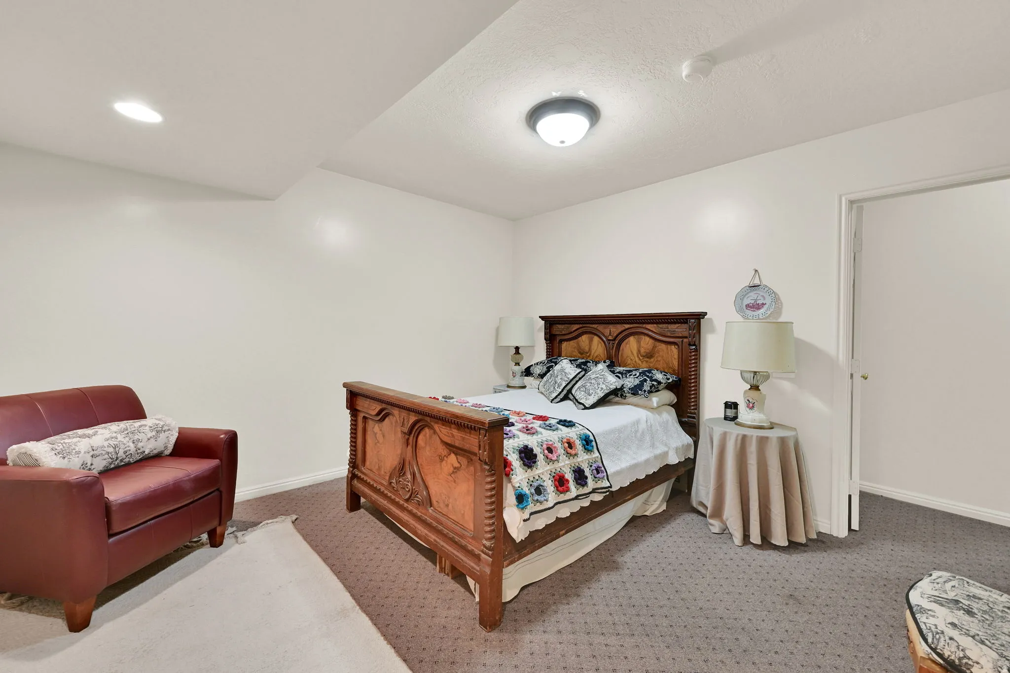Spacious bedroom #5 featuring neutral painted walls, recessed lighting, and patterned carpeting