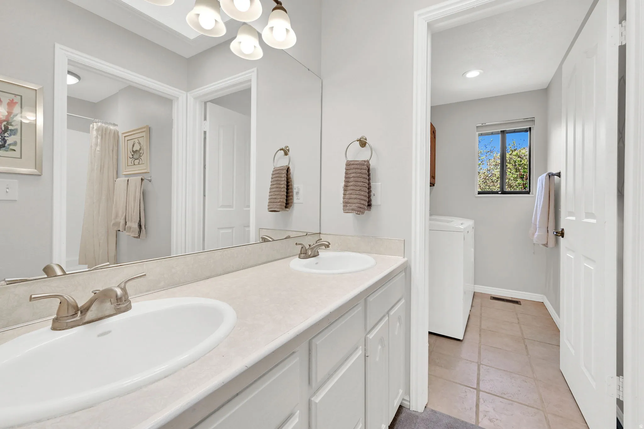 Dual vanity with undermount sinks and brushed nickel fixtures