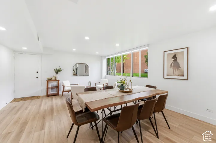 Recessed lighting, wood-finish flooring, and expansive windows