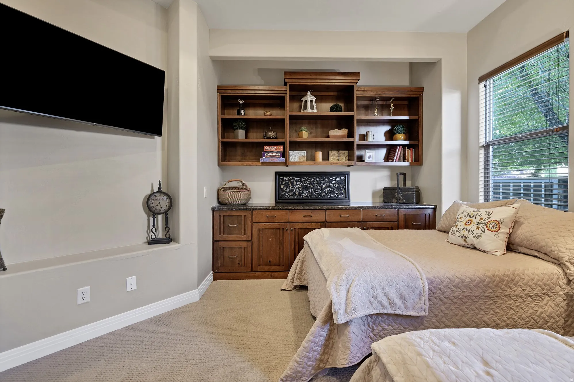 Built-in custom cabinetry with dark wood finishes and a dark stone countertop