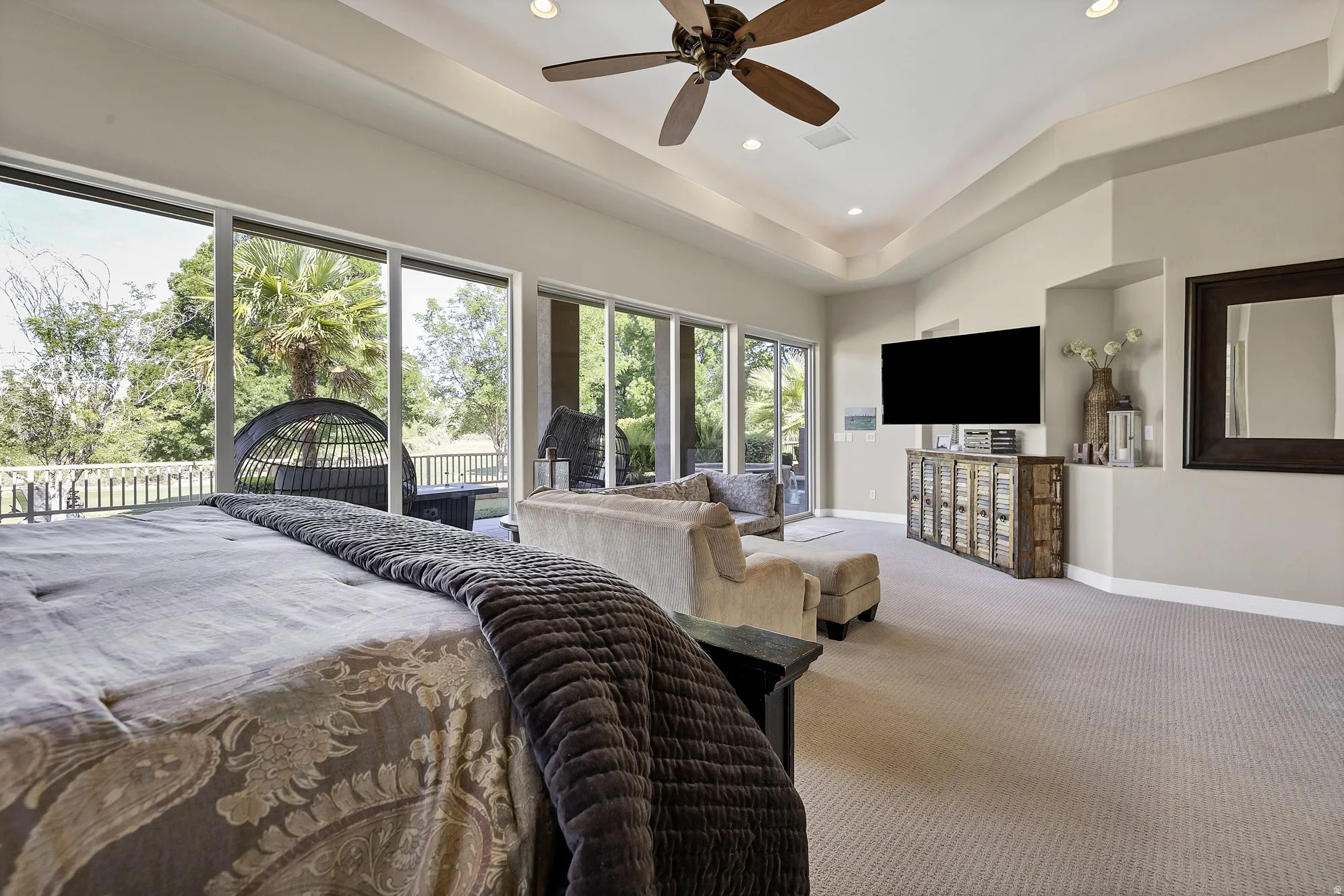 Spacious room with extensive sliding glass doors opening to an outdoor patio