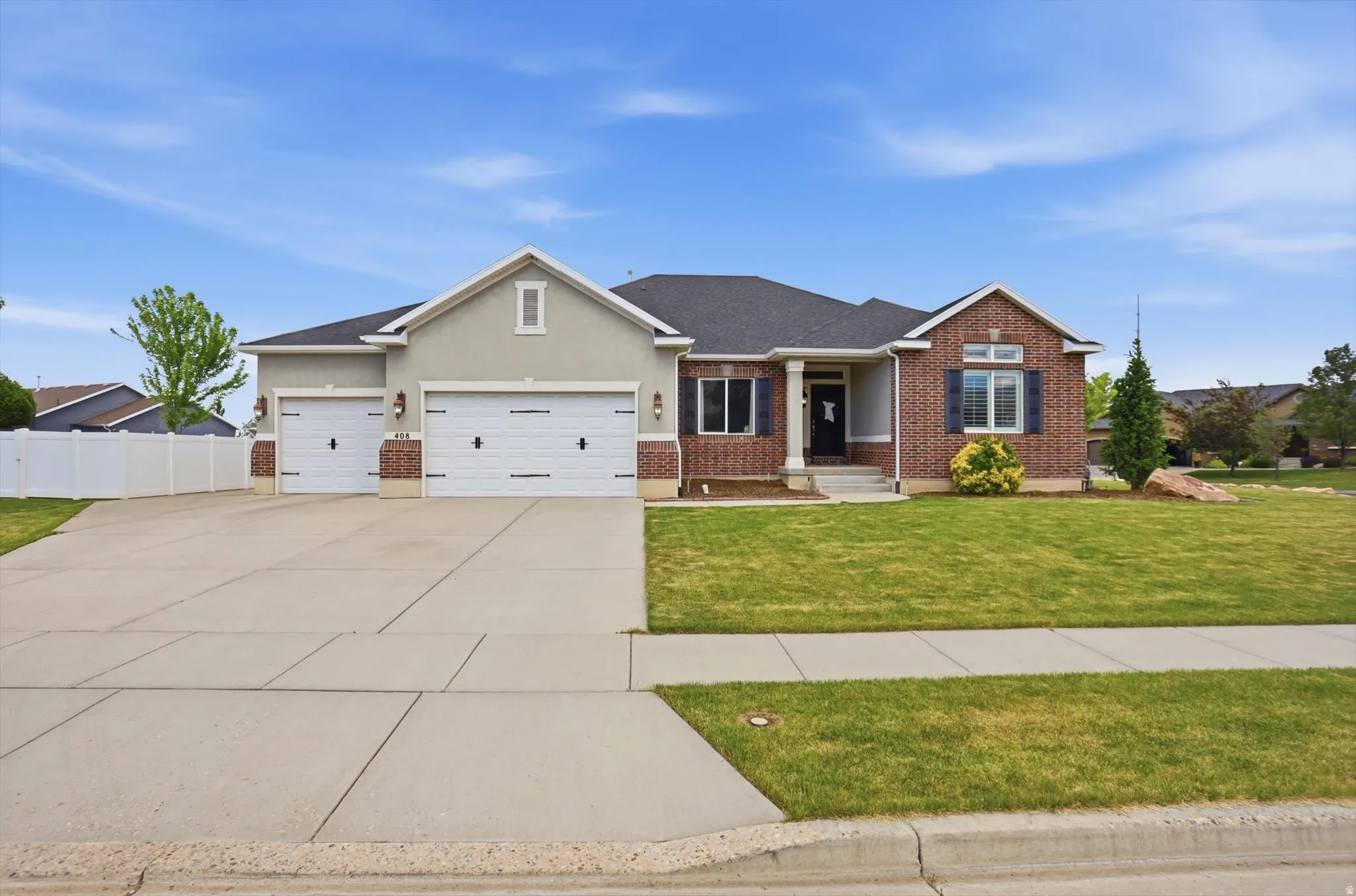 Exterior featuring brick and stucco finishes