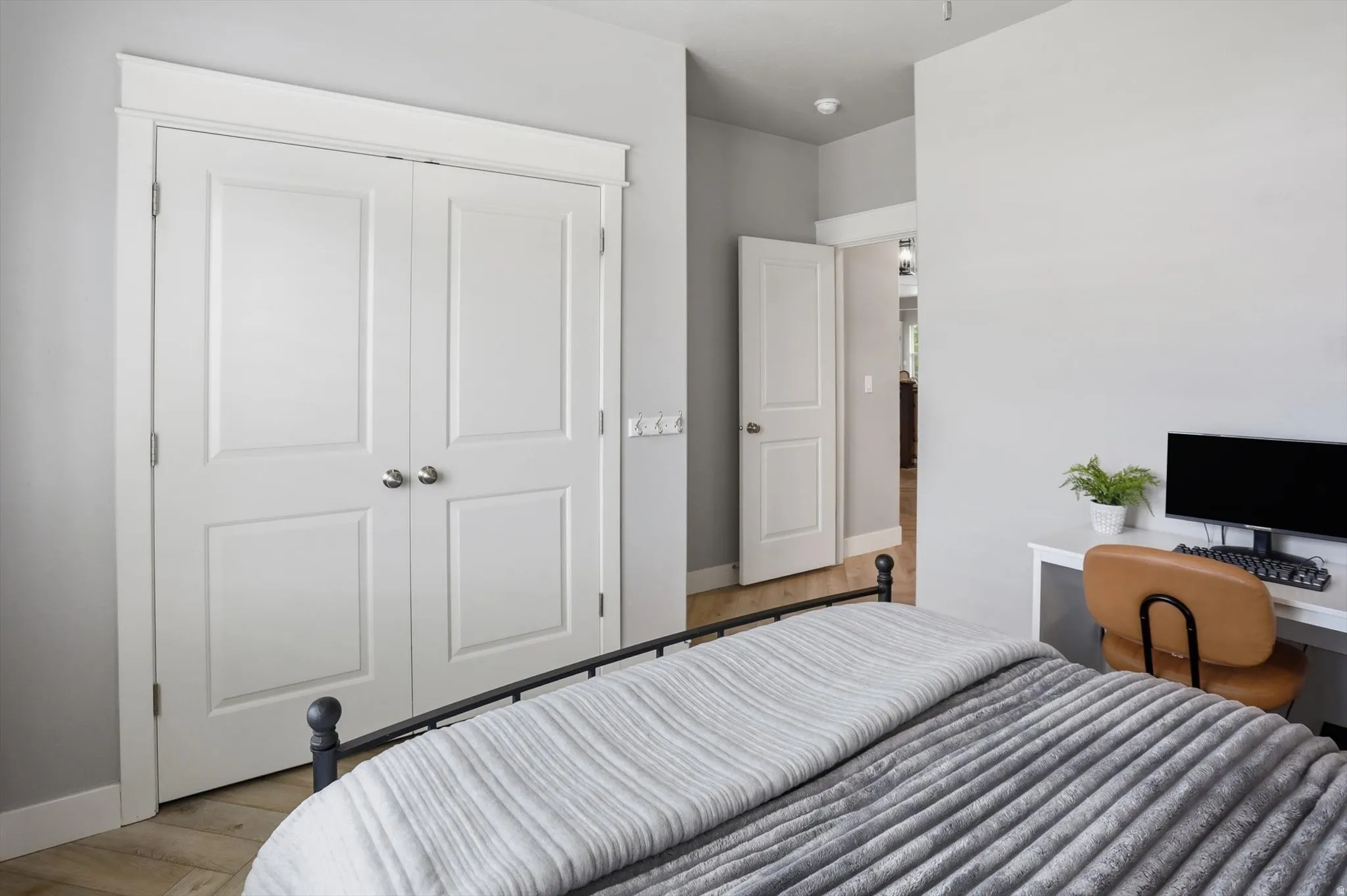 Bedroom #2 Light-toned walls with contrasting white trim throughout