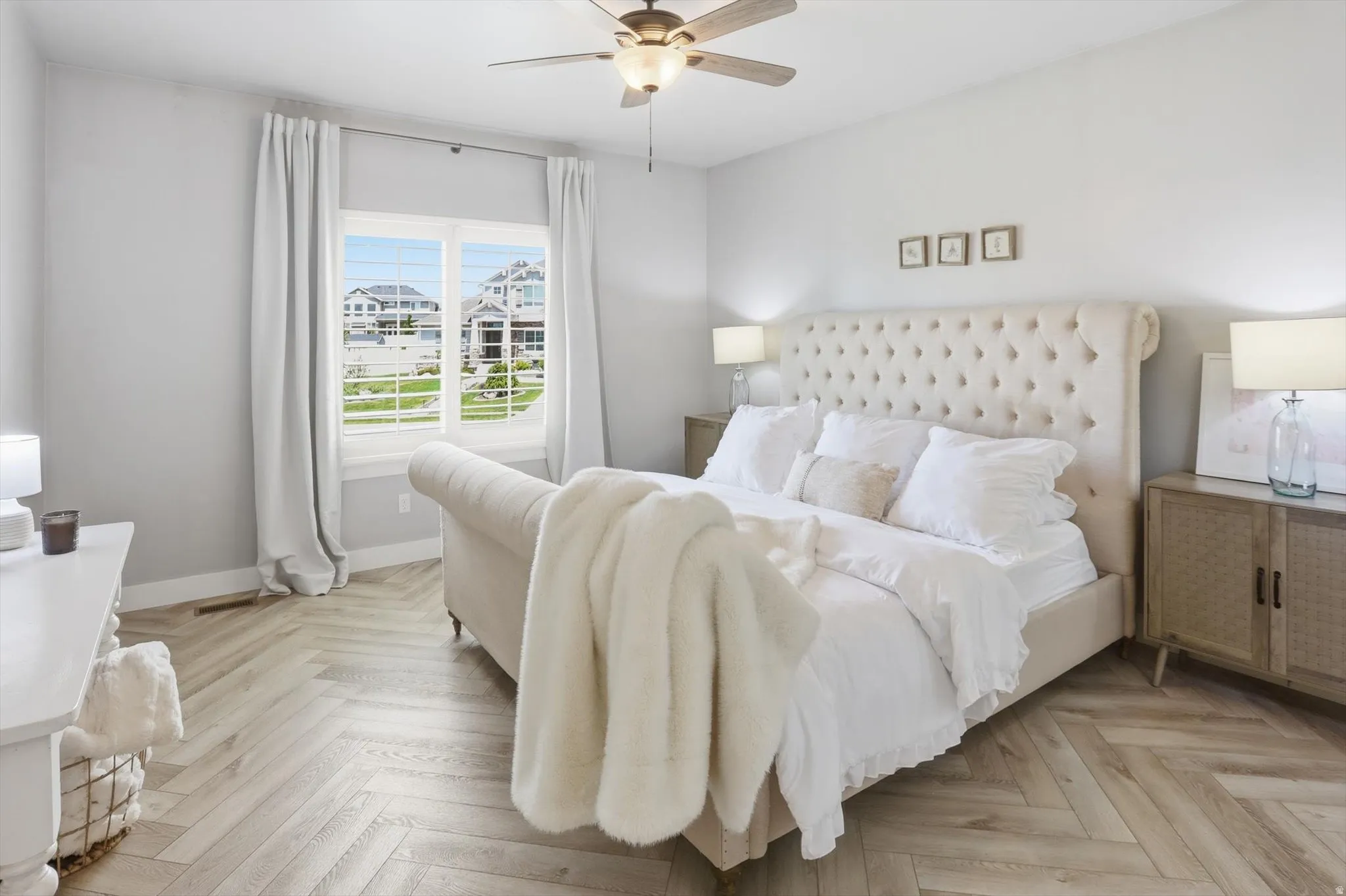 Spacious Master Light wood-finish flooring in a herringbone pattern
