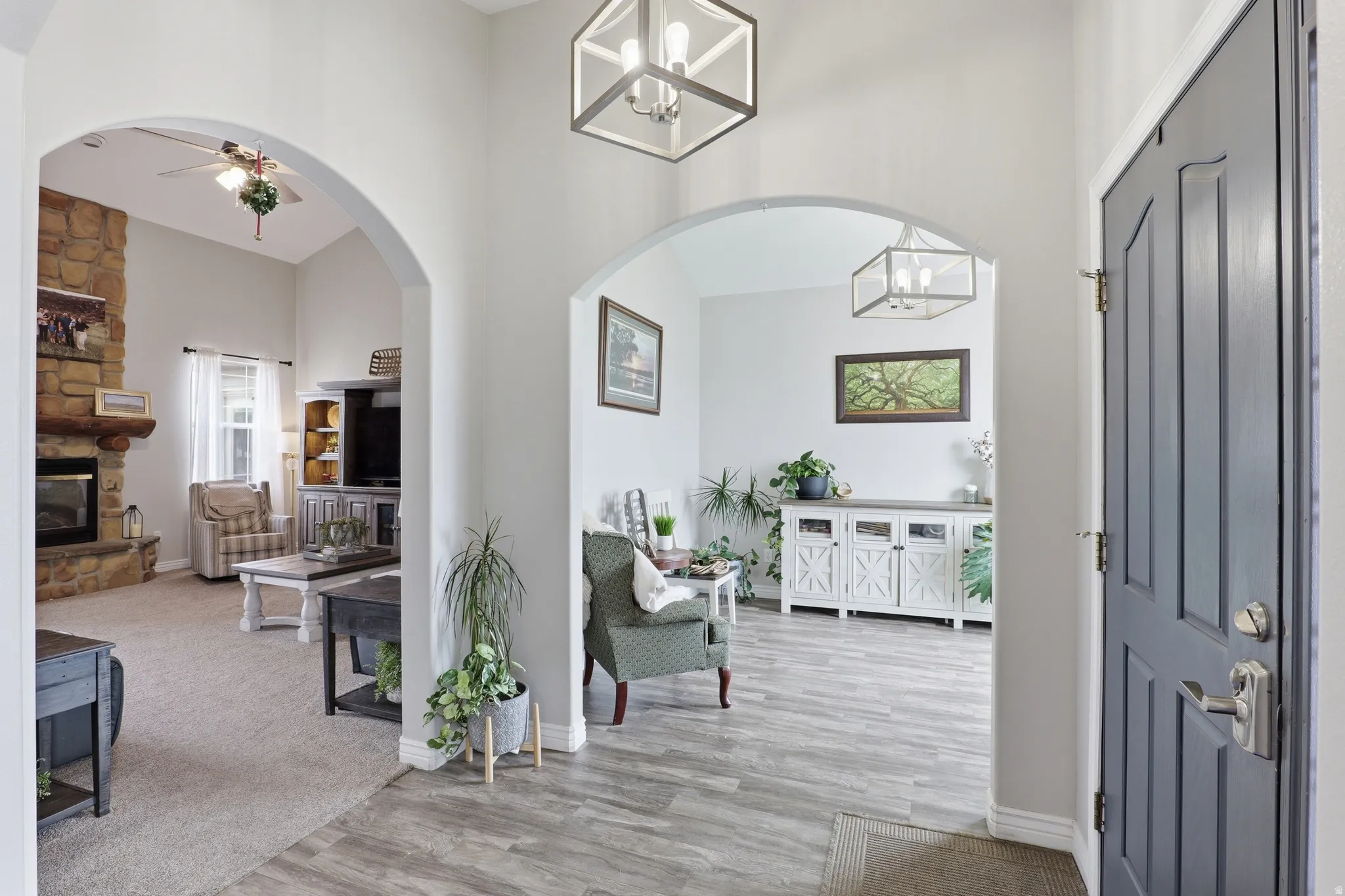 Entryway featuring wood-finish flooring and a paneled door with brushed nickel hardware