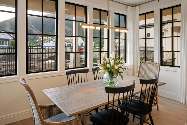Dining space with wood finished floors and baseboards