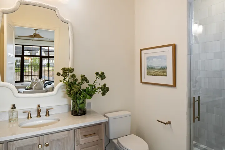 Bathroom with a stall shower and vanity