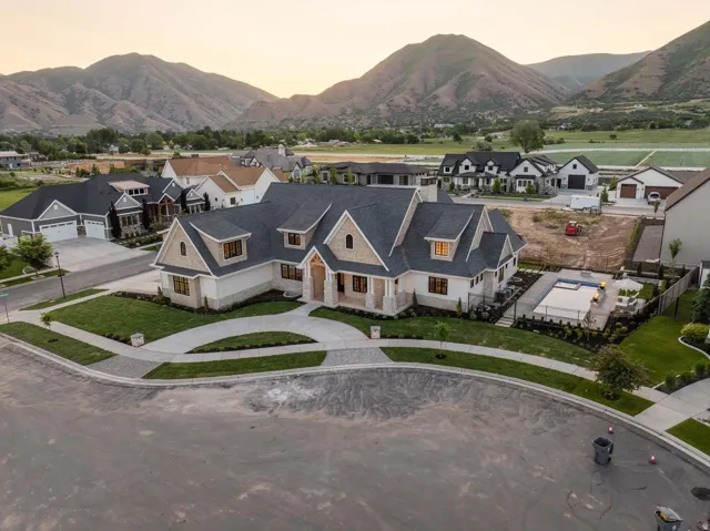 Aerial perspective of suburban area with a mountainous background