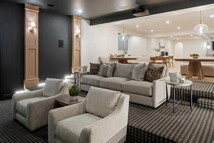 Home theater room with recessed lighting, carpet floors, arched walkways, and beam ceiling