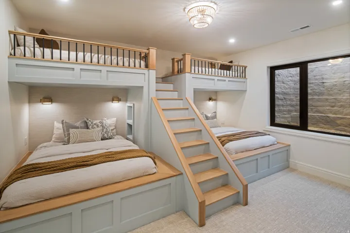 Bedroom featuring baseboards and light carpet