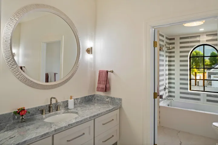Bathroom featuring vanity and shower / tub combination