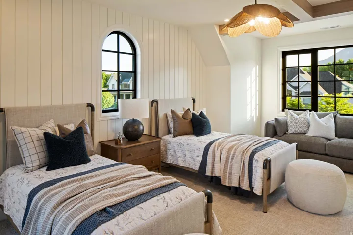 Carpeted bedroom featuring vaulted ceiling