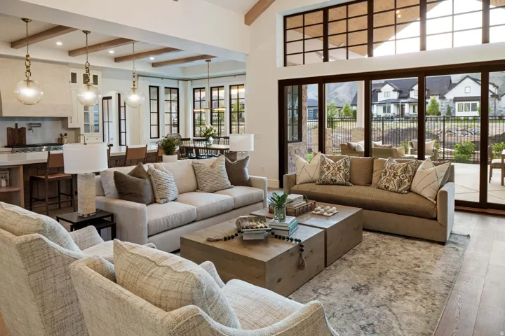 Living area with wood finished floors, beam ceiling, and recessed lighting