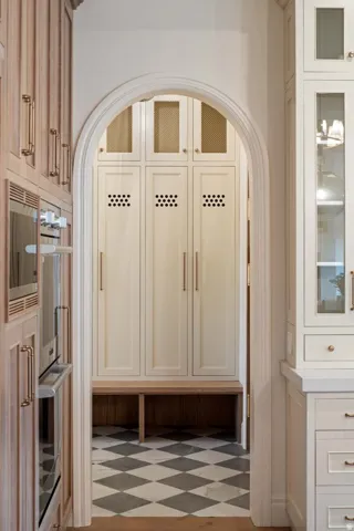 Mudroom featuring arched walkways