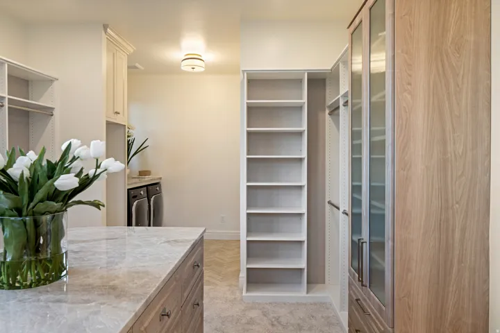 Walk in closet featuring separate washer and dryer