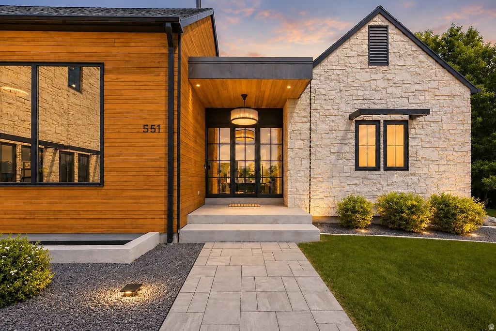 Modern exterior showcasing a combination of wood-finish siding and stone facade