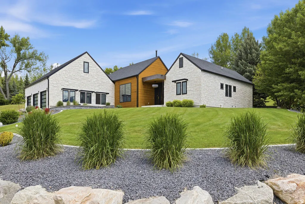 Contemporary architecture featuring a white brick and natural wood exterior