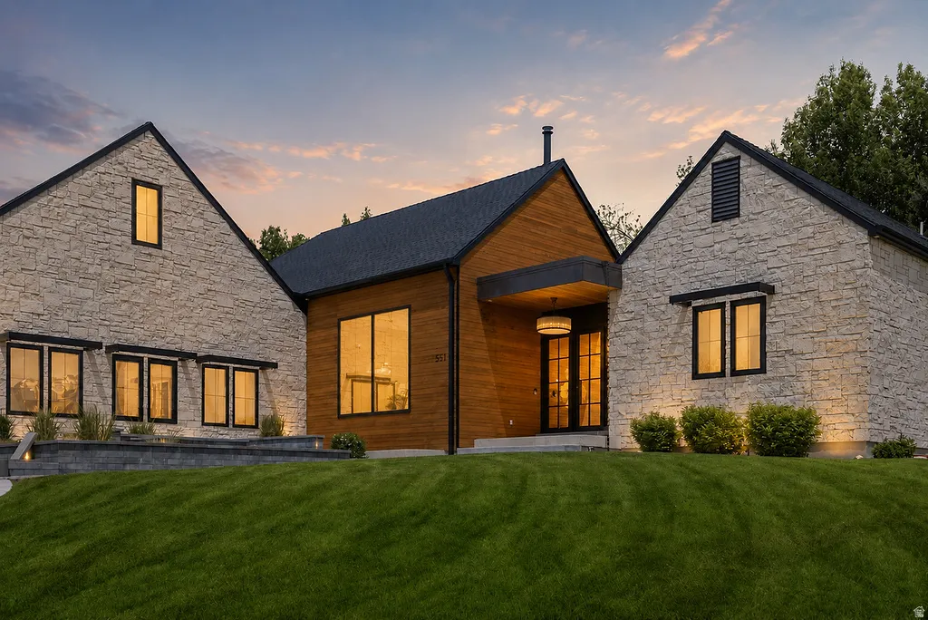 Exterior featuring stone veneer and vertical wood siding