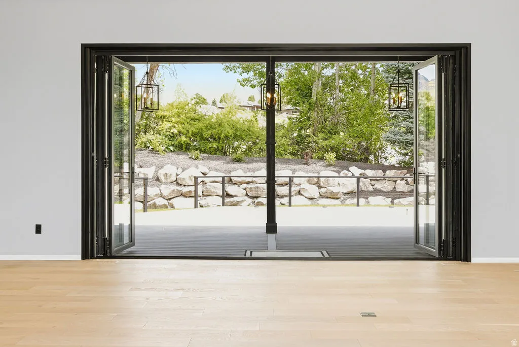 Folding glass patio doors opening to an outdoor living space