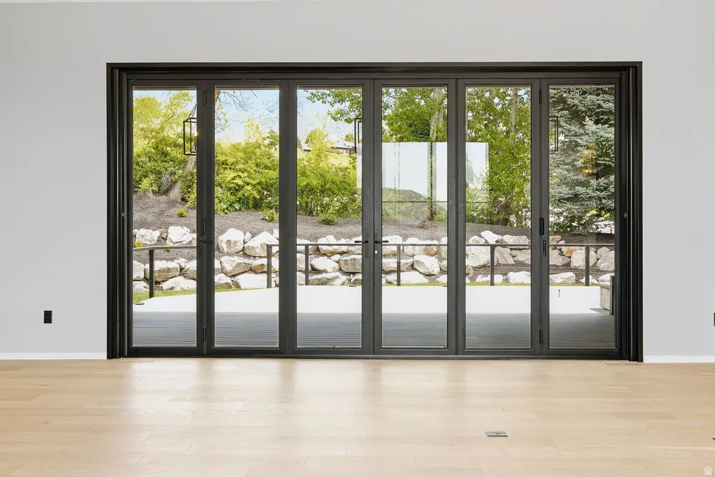 Expansive multi-panel glass doors with dark framing