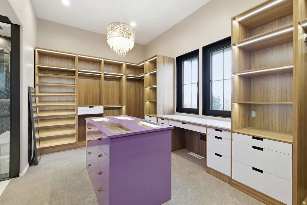 Custom closet system featuring natural wood-finish shelving and hanging rods