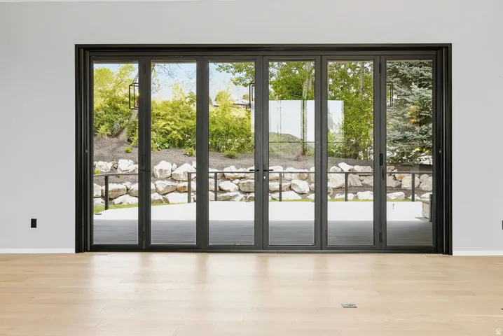 Expansive multi-panel glass doors with dark framing
