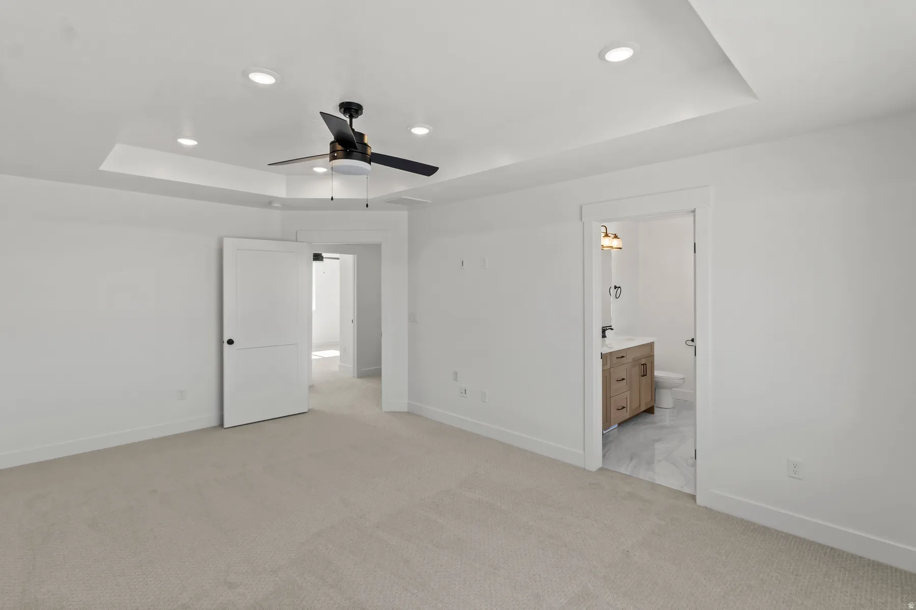 Recessed lighting in a tray ceiling with a ceiling fan