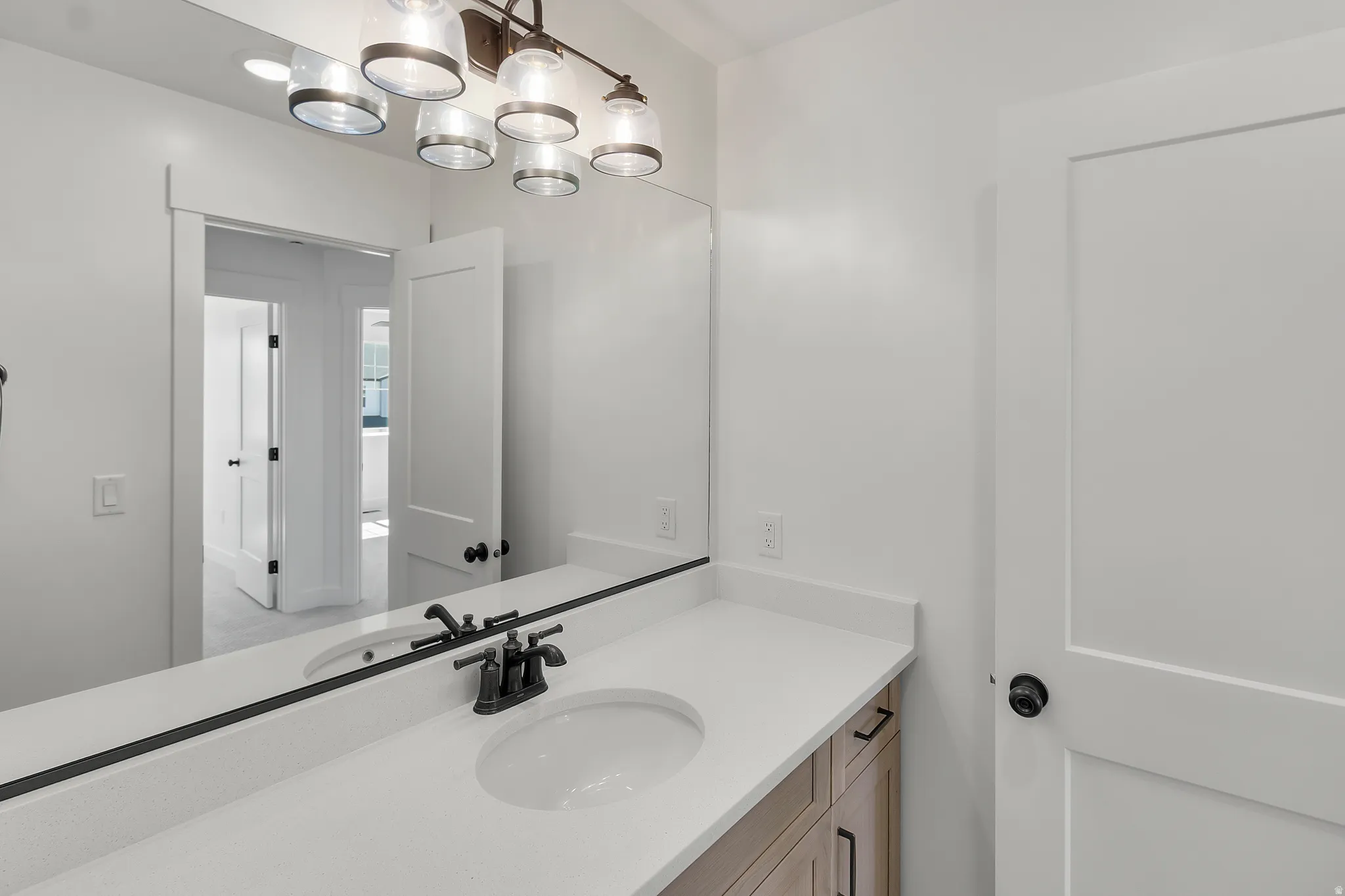 Double vanity with undermount sinks and matte black fixtures