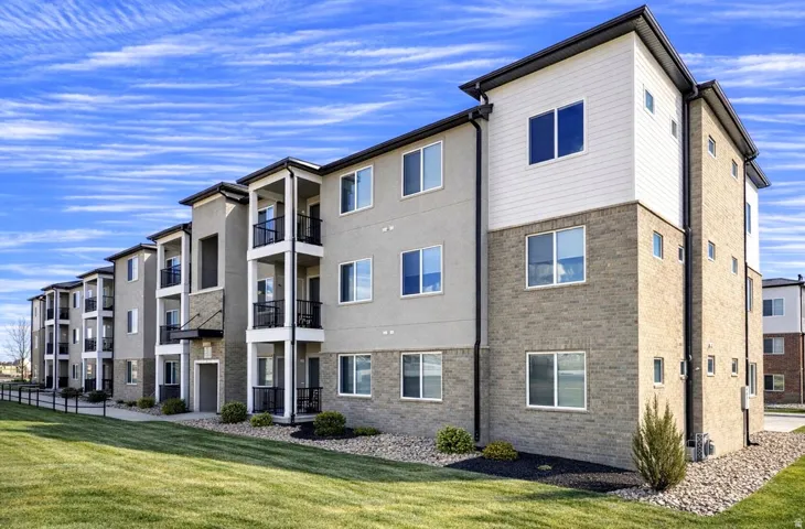 Multi-story building with a stucco and brick exterior
