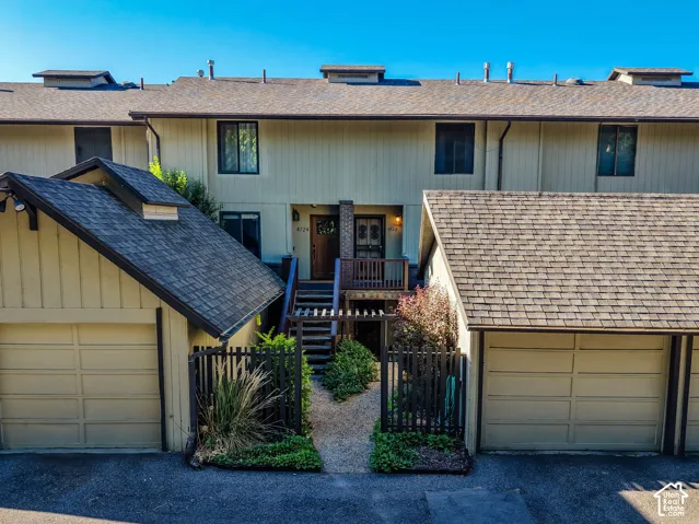 Multi-level townhome exterior featuring an inviting entry deck