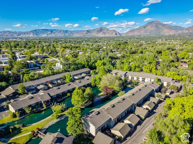 Aerial perspective showcasing multiple two-story residential buildings with shingle roofs