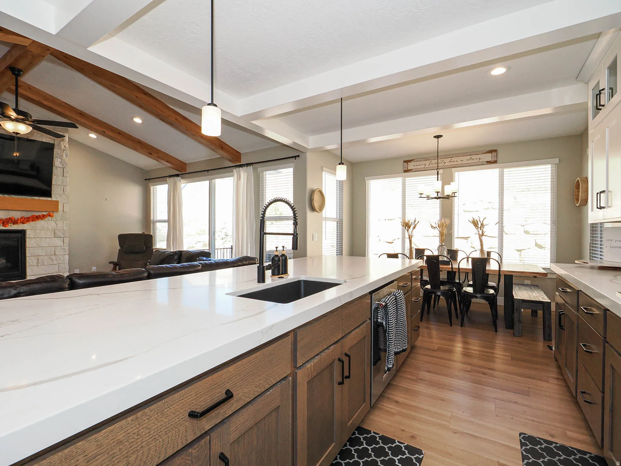 Kitchen island with a solid surface countertop and undermount sink