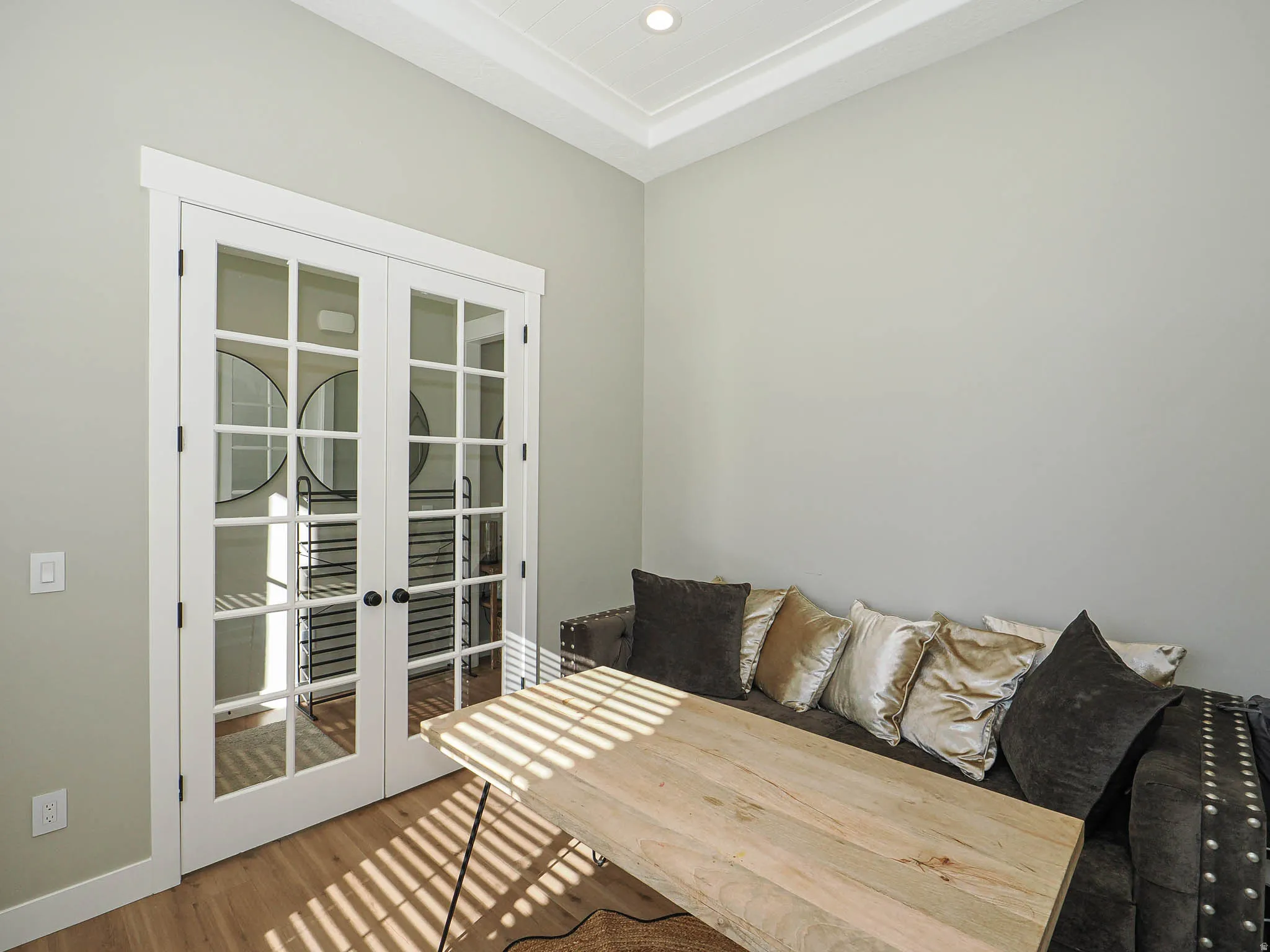 French doors with grid-pane glass, crown molding, light wood-finish flooring, and recessed lighting