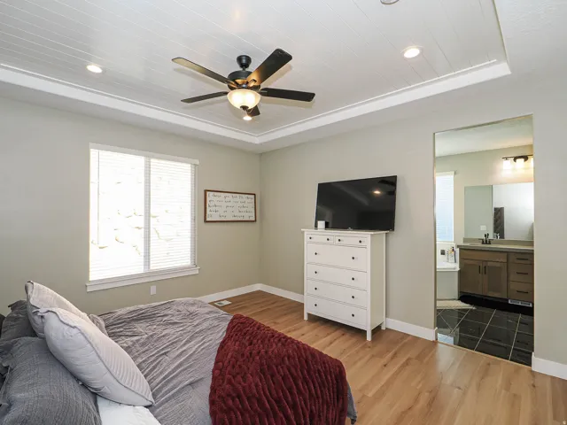 Tray ceiling with shiplap detailing and recessed lighting