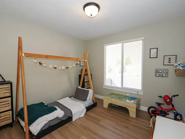 Light-filled room featuring wood-finish flooring and neutral wall tones